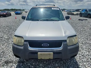 2003 Ford Escape XLT Popular with VIN 1FMYU03103KA06199, listed as a Copart auction lot 58731515 with 181,429 mi miles and Salvage title. Bid and sale history available at DreamBid. Image 5.