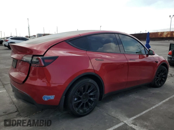 2021 Tesla Model Y Long Range with VIN 5YJYGDEEXMF217816, listed as a Copart auction lot 51008665 with 57,392 mi miles and Salvage Title. Bid and sale history available at DreamBid. Image 3.