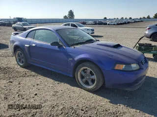 2003 Ford Mustang GT Deluxe with VIN 1FAFP42X13F320605, listed as a Copart auction lot 65006765 with 144,718 mi miles and Clean title. Bid and sale history available at DreamBid. Image 4.