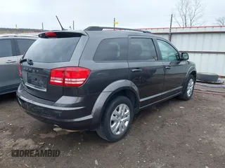 2017 Dodge Journey SE with VIN 3C4PDCAB9HT603595, listed as a IAAI auction lot 41914690 with 104,960 mi miles and . Bid and sale history available at DreamBid. Image 4.