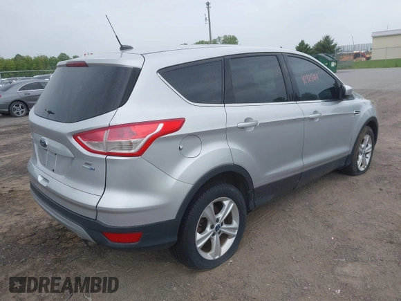 2014 Ford Escape SE z VIN 1FMCU9GX9EUC35713, wystawiony jako IAAI lot #42323161 z przebiegiem 169 393 mil mil oraz . Historia ofert i sprzedaży dostępna na DreamBid. Obrazek 4.