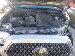 2018 Toyota Tacoma SR with VIN 5TFCZ5AN3JX151479, listed as a IAAI auction lot 41428376 with 104,717 mi miles. Bid and sale history available at carsss.com. Image 10.