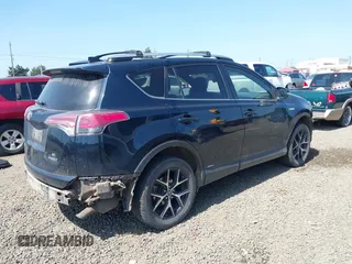 2018 Toyota RAV4 Hybrid SE with VIN JTMJJREV9JD191552, listed as a IAAI auction lot 42158665 with 84,025 mi miles and . Bid and sale history available at DreamBid. Image 4.
