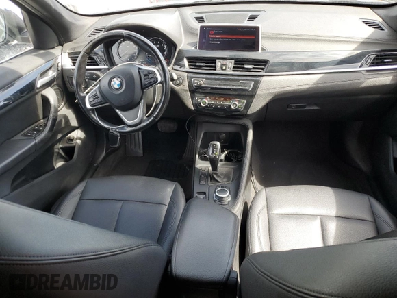 2020 BMW X1 xDrive28i with VIN WBXJG9C0XL5R33141, listed as a Copart auction lot 63040155 with 165,172 mi miles and Clean title. Bid and sale history available at DreamBid. Image 8.