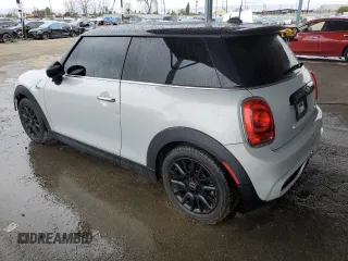 2014 MINI Hardtop S with VIN WMWXM7C57ET985421, listed as a Copart auction lot 49443335 with 76,168 mi miles and Salvage Title. Bid and sale history available at DreamBid. Image 2.