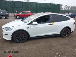 2022 Tesla Model X Plaid z VIN 7SAXCBE67NF339557, wystawiony jako IAAI lot #41825360 z przebiegiem 70 mil mil oraz . Historia ofert i sprzedaży dostępna na DreamBid. Obrazek 14.