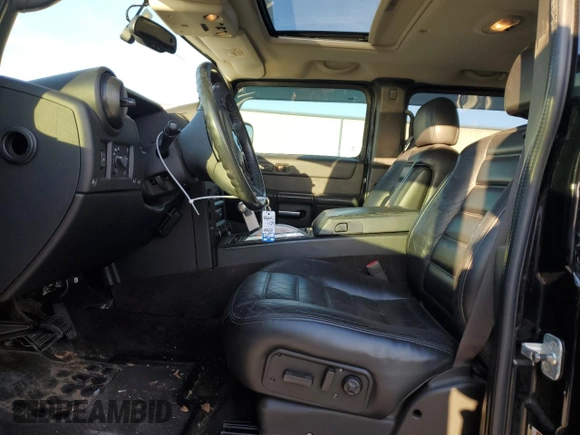 2005 Hummer H2 SUT z VIN 5GRGN22U85H109003, wystawiony jako Copart lot #76557734 z przebiegiem 115 249 mil mil oraz Szkoda całkowita • Salvage title. Historia ofert i sprzedaży dostępna na DreamBid. Obrazek 7.