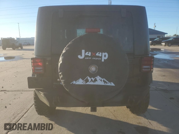 2010 Jeep Wrangler Rubicon with VIN 1J4BA6D10AL203265, listed as a Copart auction lot 79570754 with 114,840 mi miles and Salvage title. Bid and sale history available at DreamBid. Image 6.