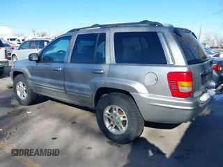 2001 Jeep Grand Cherokee Limited with VIN 1J4GW58N91C688438, listed as a IAAI auction lot 41830334 with 184,420 mi miles. Bid and sale history available at carsss.com. Image 3.