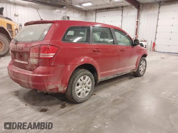 2015 Dodge Journey American Value z VIN 3C4PDCAB5FT720300, wystawiony jako IAAI lot #42074690 z przebiegiem 144 690 mil mil oraz . Historia ofert i sprzedaży dostępna na DreamBid. Obrazek 4.