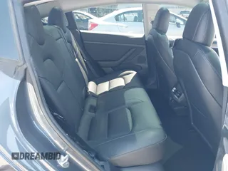2023 Tesla Model 3 with VIN 5YJ3E1EAXPF405588, listed as a IAAI auction lot 42348952 with 30,788 mi miles and . Bid and sale history available at DreamBid. Image 8.