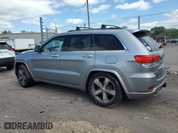 2015 Jeep Grand Cherokee Overland with VIN 1C4RJFCG3FC880084, listed as a Copart auction lot 57291165 with 112,442 mi miles and Salvage title. Bid and sale history available at DreamBid. Image 2.
