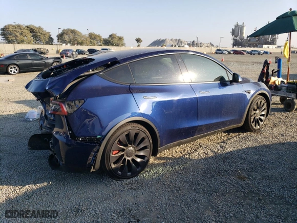 2023 Tesla Model Y Performance with VIN 7SAYGDEF5PF713543, listed as a Copart auction lot 80996714 with 33,311 mi miles and Salvage Title. Bid and sale history available at carsss.com. Image 3.