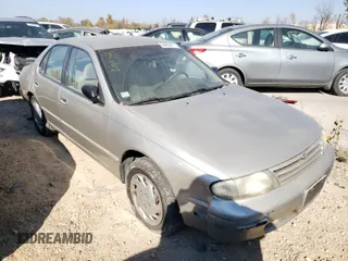 1996 Nissan Altima XE with VIN 1N4BU31D9TC133056, listed as a Copart auction lot 64459811 with 127,029 mi miles and Salvage Title. Bid and sale history available at DreamBid. Image 1.