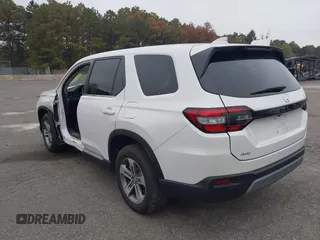 2023 Honda Pilot EX-L with VIN 5FNYG1H58PB016138, listed as a IAAI auction lot 40591717 with 10,068 mi miles and . Bid and sale history available at DreamBid. Image 3.