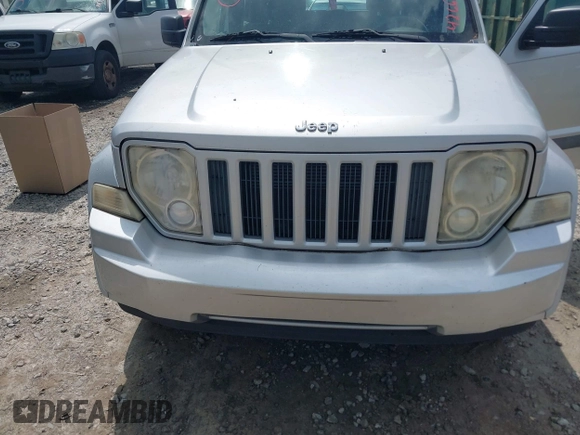 2012 Jeep Liberty Sport z VIN 1C4PJLAK0CW111694, wystawiony jako IAAI lot #42667595 z przebiegiem 78 451 mil mil oraz . Historia ofert i sprzedaży dostępna na DreamBid. Obrazek 6.