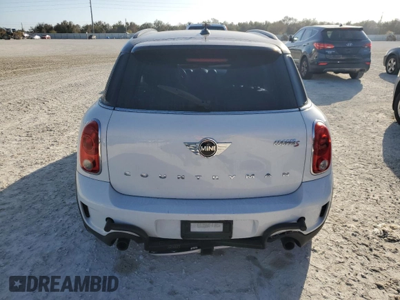 2016 MINI Countryman S with VIN WMWZC5C51GWU01290, listed as a Copart auction lot 77684384 with 106,811 mi miles and Salvage Title. Bid and sale history available at DreamBid. Image 6.