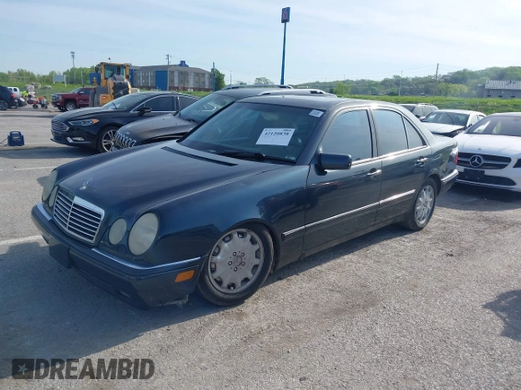 1997 Mercedes-Benz E-Class with VIN WDBJF55F7VJ027080, listed as a IAAI auction lot 42120838 with 150,197 mi miles. Bid and sale history available at carsss.com. Image 2.