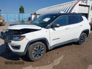 2021 Jeep Compass Trailhawk with VIN 3C4NJDDB0MT551172, listed as a IAAI auction lot 40155947 with 50,794 mi miles and . Bid and sale history available at DreamBid. Image 2.
