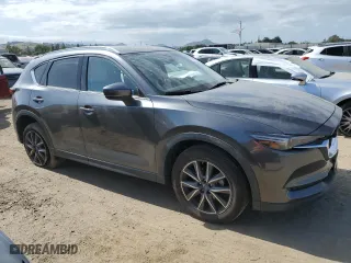 2018 Mazda CX-5 Grand Touring with VIN JM3KFBDM1J0357194, listed as a Copart auction lot 53583935 with 38,639 mi miles and Salvage Title. Bid and sale history available at carsss.com. Image 4.