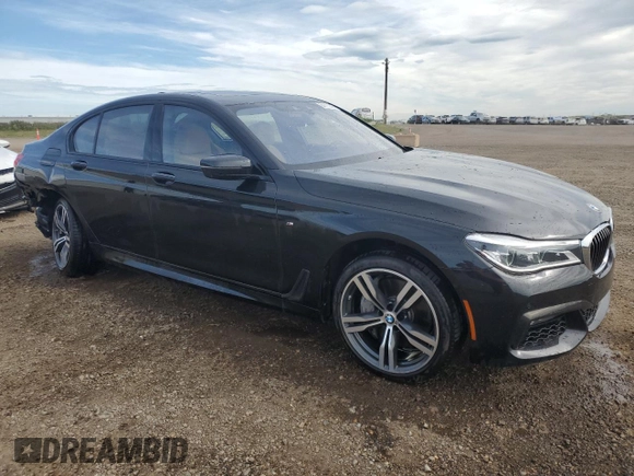 2019 BMW 7 Series 750i xDrive with VIN WBA7B0C53KG527537, listed as a Copart auction lot 64113345 with 36,820 mi miles and Salvage title. Bid and sale history available at DreamBid. Image 4.
