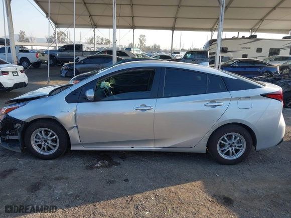 2019 Toyota Prius L Eco with VIN JTDKARFU2K3082593, listed as a IAAI auction lot 41657698 with 239,412 mi miles. Bid and sale history available at carsss.com. Image 14.
