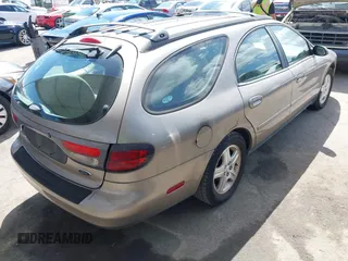 2002 Ford Taurus z VIN 1FAHP59U52G115825, wystawiony jako IAAI lot #41904552 z przebiegiem 91 004 mil mil oraz . Historia ofert i sprzedaży dostępna na DreamBid. Obrazek 4.