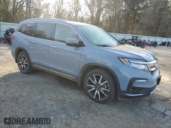 2022 Honda Pilot Touring 7-Passenger with VIN 5FNYF5H69NB031537, listed as a Copart auction lot 48986685 with 88,301 mi miles and Salvage title. Bid and sale history available at DreamBid. Image 4.