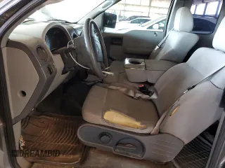 2005 Ford F-150 STX with VIN 1FTRX12W25NA37703, listed as a Copart auction lot 60089325 with 128,651 mi miles and Salvage title. Bid and sale history available at DreamBid. Image 7.