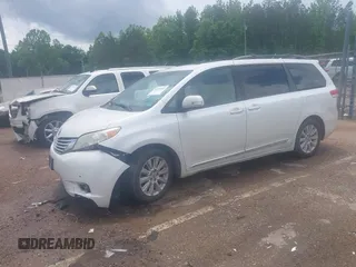 2014 Toyota Sienna XLE with VIN 5TDYK3DC2ES517663, listed as a IAAI auction lot 42171862 with 143,447 mi miles and . Bid and sale history available at DreamBid. Image 2.