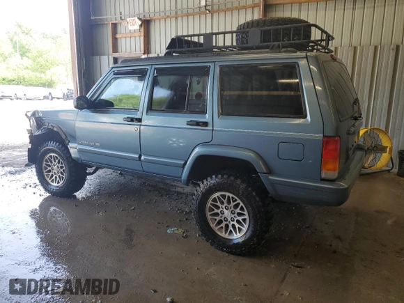 1998 Jeep Cherokee Country with VIN 1J4FT78S8WL252502, listed as a Copart auction lot 59664545 with 133,148 mi miles and Salvage title. Bid and sale history available at DreamBid. Image 2.