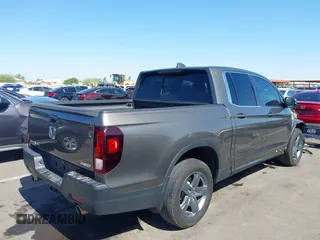 2022 Honda Ridgeline RTL with VIN 5FPYK3F58NB007618, listed as a IAAI auction lot 42258443 with 14,036 mi miles and . Bid and sale history available at DreamBid. Image 4.
