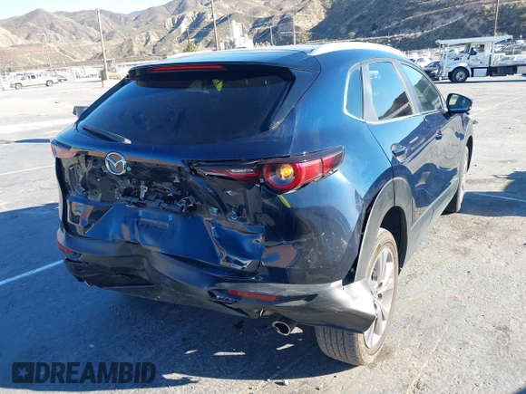 2023 Mazda CX-30 S Select with VIN 3MVDMBBM8PM514475, listed as a IAAI auction lot 41664456 with 33,076 mi miles and . Bid and sale history available at DreamBid. Image 4.