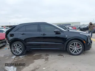 2021 Cadillac XT4 FWD Sport with VIN 1GYFZER40MF039140, listed as a IAAI auction lot 41287513 with 51,725 mi miles and . Bid and sale history available at DreamBid. Image 14.