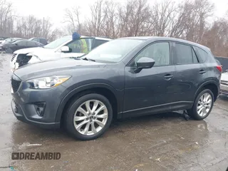 2014 Mazda CX-5 Grand Touring with VIN JM3KE4DY0E0392476, listed as a IAAI auction lot 41419144 with 89,245 mi miles and . Bid and sale history available at carsss.com. Image 14.