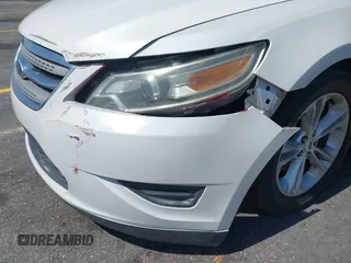2014 Ford Taurus SEL with VIN 1FAHP2E86EG132676, listed as a IAAI auction lot 41943392 with 183,633 mi miles. Bid and sale history available at carsss.com. Image 6.
