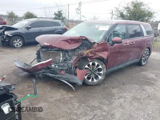 2022 Kia Carnival EX with VIN KNDNC5H36N6097184, listed as a IAAI auction lot 41024289 with 58,722 mi miles and . Bid and sale history available at DreamBid. Image 2.