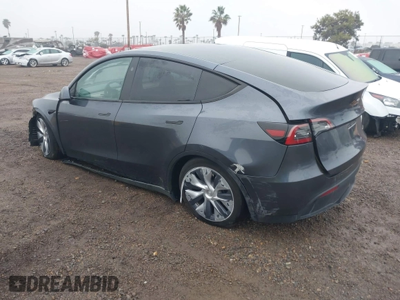 2023 Tesla Model Y Long Range with VIN 7SAYGDEE7PF894362, listed as a IAAI auction lot 41512492 with 27,513 mi miles. Bid and sale history available at carsss.com. Image 3.