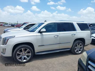2015 Cadillac Escalade Luxury z VIN 1GYS4BKJ1FR215223, wystawiony jako IAAI lot #42548931 z przebiegiem 145 947 mil mil oraz . Historia ofert i sprzedaży dostępna na DreamBid. Obrazek 14.