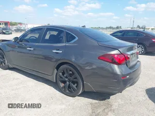 2013 Infiniti M37 with VIN JN1BY1AP8DM511850, listed as a IAAI auction lot 42063120 with 111,545 mi miles. Bid and sale history available at carsss.com. Image 3.