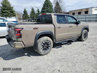 2022 Nissan Frontier PRO-4X with VIN 1N6ED1EK0NN671881, listed as a Copart auction lot 49579385 with 22,061 mi miles and Salvage Title. Bid and sale history available at carsss.com. Image 3.
