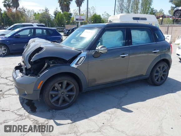 2012 MINI Countryman S with VIN WMWZC3C53CWL83664, listed as a IAAI auction lot 42062673 with 102,615 mi miles and . Bid and sale history available at DreamBid. Image 2.