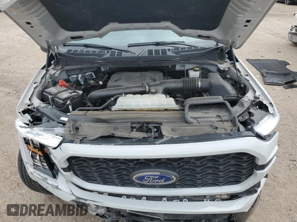 2023 Ford F-150 XL with VIN 1FTFW1E84PKE35275, listed as a Copart auction lot 61867535 with 22,142 mi miles and Salvage title. Bid and sale history available at DreamBid. Image 11.