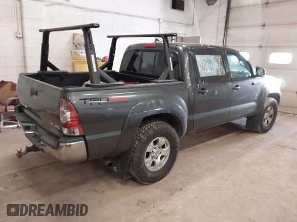 2014 Toyota Tacoma with VIN 3TMLU4EN3EM151917, listed as a IAAI auction lot 41769083 with 216,910 mi miles. Bid and sale history available at carsss.com. Image 4.