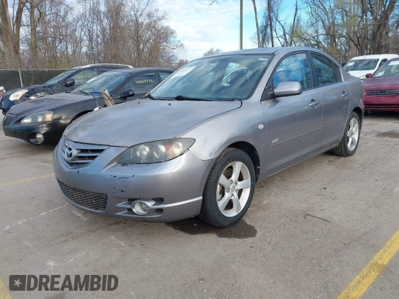 2005 Mazda 3 s with VIN JM1BK323551245843, listed as a IAAI auction lot 41860274 with 166,579 mi miles. Bid and sale history available at carsss.com. Image 2.