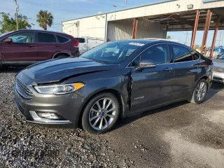 2017 Ford Fusion Hybrid SE с VIN 3FA6P0LU9HR392742, выставлен на аукционе Copart как лот 65894795 с пробегом 71 828 миль миль и Списание • Salvage title. История ставок и продаж доступна на DreamBid. Изображение 1.