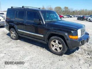 2010 Jeep Commander Sport with VIN 1J4RG4GKXAC156977, listed as a IAAI auction lot 41813409 with 221,796 mi miles. Bid and sale history available at carsss.com. Image 1.