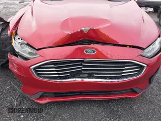 2020 Ford Fusion SE z VIN 3FA6P0T97LR234873, wystawiony jako IAAI lot #41510333 z przebiegiem 65 243 mil mil oraz . Historia ofert i sprzedaży dostępna na DreamBid. Obrazek 18.