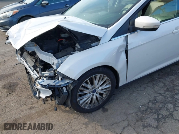 2018 Ford Focus Titanium z VIN 1FADP3J25JL293835, wystawiony jako IAAI lot #41877487 z przebiegiem 109 211 mil mil oraz . Historia ofert i sprzedaży dostępna na DreamBid. Obrazek 14.
