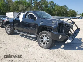 2018 Chevrolet Silverado 1500 LT with VIN 3GCUKRECXJG503244, listed as a Copart auction lot 52792825 with 107,029 mi miles and Salvage Title. Bid and sale history available at DreamBid. Image 4.